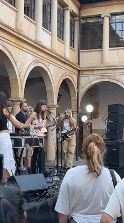 Live music fills a historic Oviedo courtyard on a summer evening.