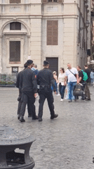Tourists photograph Four Rivers fountain in Rome's Piazza Navona