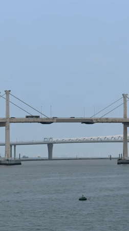 Morning harbor activity documented across Macau bridges and waterways