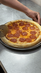 Pizza preparation documented at Chaikovsky restaurant