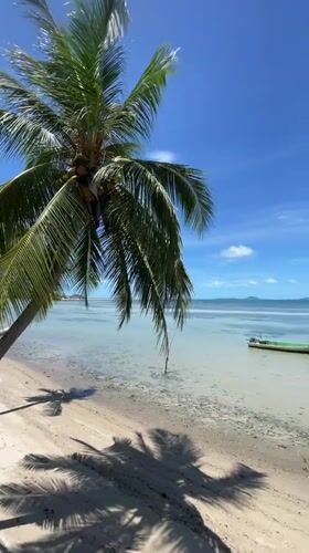Peaceful beach scene documented in Ban Tai, Thailand