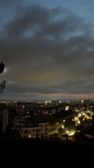 Evening cityscape recorded in Varna with silhouetted observer