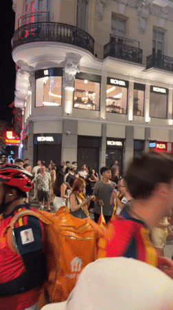 Madrid streets flood with Spanish flag-waving crowds in late-night celebration