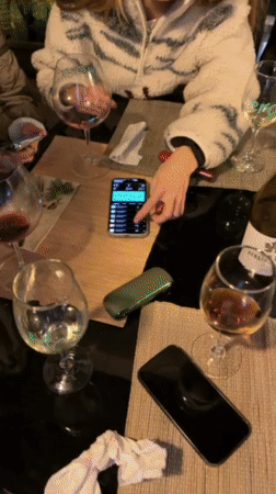 Young adults dine and socialize at Tel Aviv restaurant terrace
