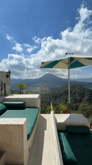 Balcony loungers overlooking Kintamani's mountain landscape