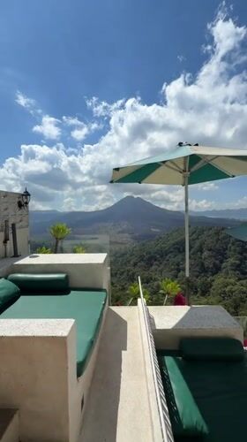 Balcony loungers overlooking Kintamani's mountain landscape