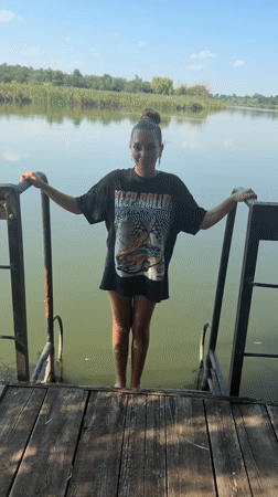 Dock jump into calm green water near Lozuvatka, Ukraine