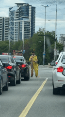 Clown performs juggling act at Sofia street crosswalk