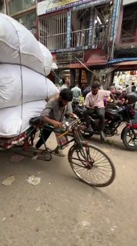 Morning street commerce activity documented across Dhaka