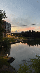 Dusk along Izhevsk's lakeside walkway, summer evening