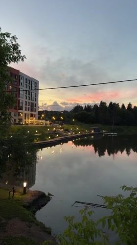 Dusk along Izhevsk's lakeside walkway, summer evening