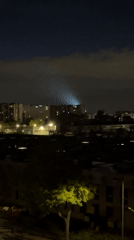 Mysterious light beam illuminates city skyline June 10