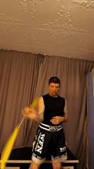 Kitten on yellow fabric and nunchaku practice in Karaganda