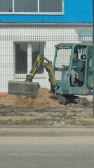 Excavator moves dirt at construction site in Hrodna
