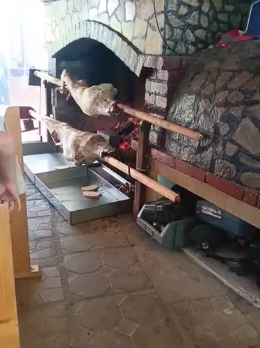 Whole animals on the spit in a Bulgarian stone oven