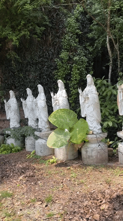 Inside Ipoh's cave temple complex, statues and shrines at every turn