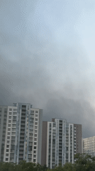 Dark smoke rises over Kyiv residential district in early morning