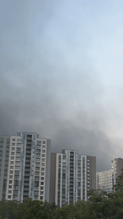 Dark smoke rises over Kyiv residential district in early morning