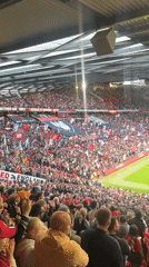 Packed Old Trafford crowd shows support during soccer match
