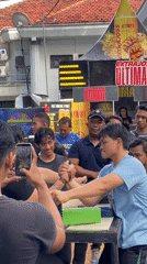 Morning street activities and arm-wrestling competitions draw crowds in Surabaya