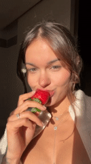 Woman enjoys meal indoors in Tel Aviv afternoon