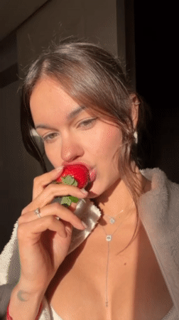 Woman enjoys meal indoors in Tel Aviv afternoon