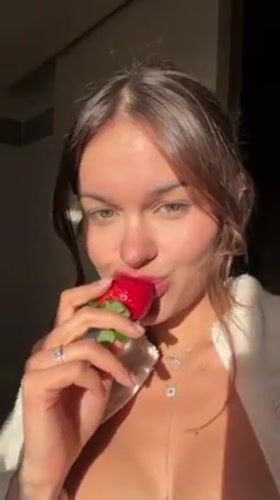Woman enjoys meal indoors in Tel Aviv afternoon