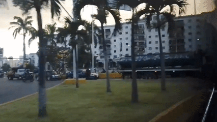 Evening street scenes captured from moving vehicle in Caracas