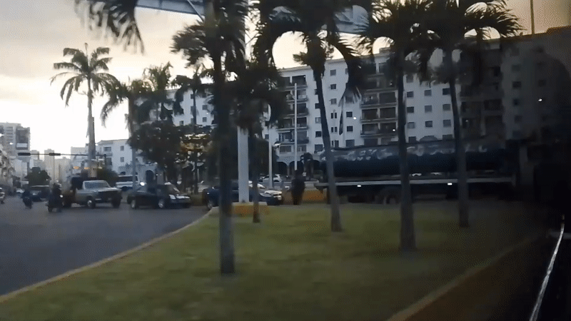 Evening street scenes captured from moving vehicle in Caracas