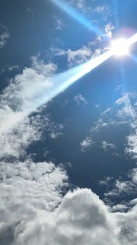 Bright sun and shifting clouds over Gatineau at midday
