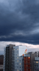 Dramatic storm clouds captured over urban landscape from high vantage