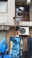 Man climbs vending machine to reach balcony via AC unit