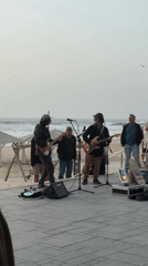 Musicians perform acoustic beach concert in Tel Aviv