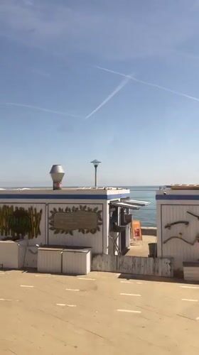 Sunny coastal drive captured along Badalona promenade