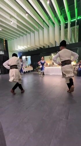Traditional folk dancing at a wedding reception in Kazichene