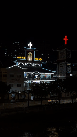 Nighttime street life and illuminated cityscape in Thủ Đức