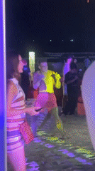 Beach party dancing captured at night in Đà Nẵng