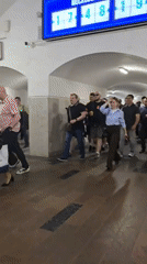 Routine subway station activity captured during afternoon rush