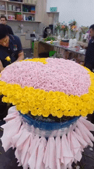 Flowers and cacti at a Kuala Lumpur market, morning prep underway