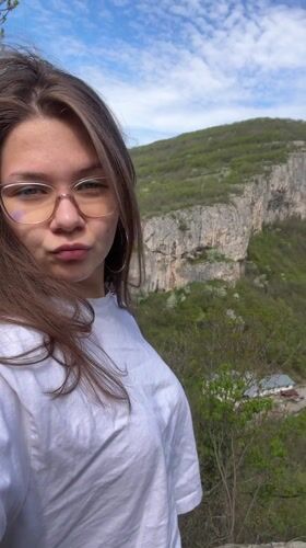 Woman enjoys scenic mountain vista in Dryanovo, Bulgaria