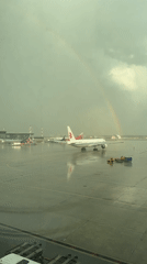 Rainbow appears over airport tarmac in Khimki during rainfall