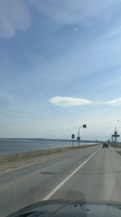 Morning drive along waterfront road captured near Noviy, Russia