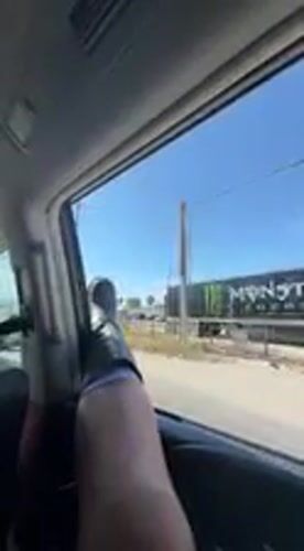 Vehicle passenger spotted with leg out window in Coachella