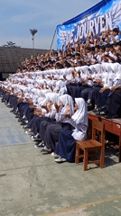 Students clapping in unison at school gathering in Tanjungsari