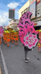 Colorful street parade with costumed dancers in Dumaguete Philippines