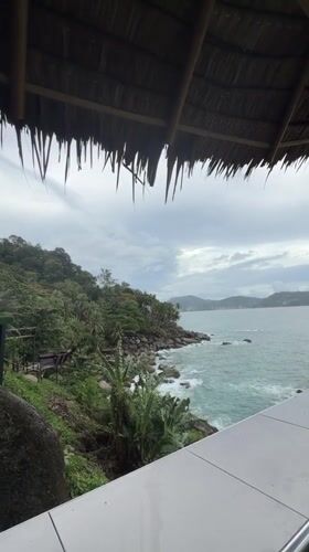 Woman enjoys scenic coastal morning in Patong, Thailand
