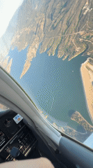 Cockpit view flying over Santa Barbara's coastal mountains and water