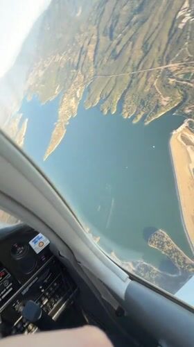 Cockpit view flying over Santa Barbara's coastal mountains and water