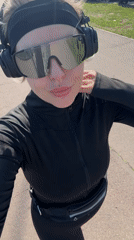 Woman records selfie video near decorated bridge in Krasnoyarsk