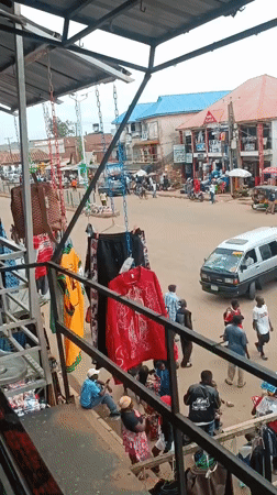 Bustling Nigerian marketplace documented during midday trading hours